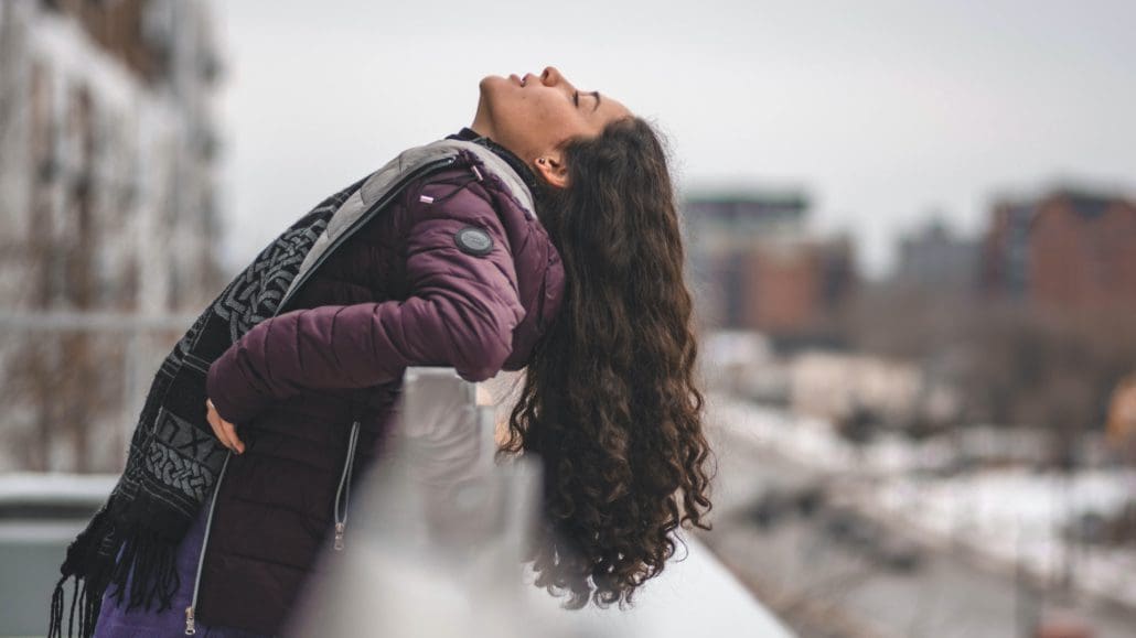 Woman looking upward happily after depression counseling